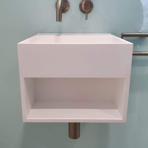 Modern, cube style sink with brushed steel taps and pipes